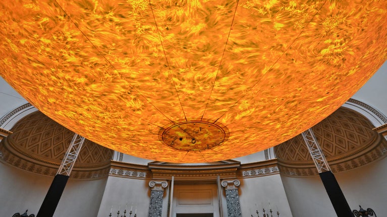 A 7 metre artwork of the sun is suspended in from the ceiling at Kedleston Hall